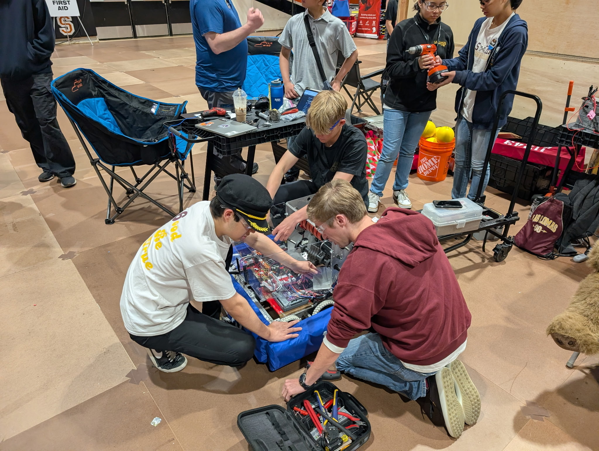 Cyber Knights students working on the competition robot